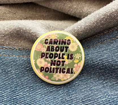 Caring About People Is Not Political Button